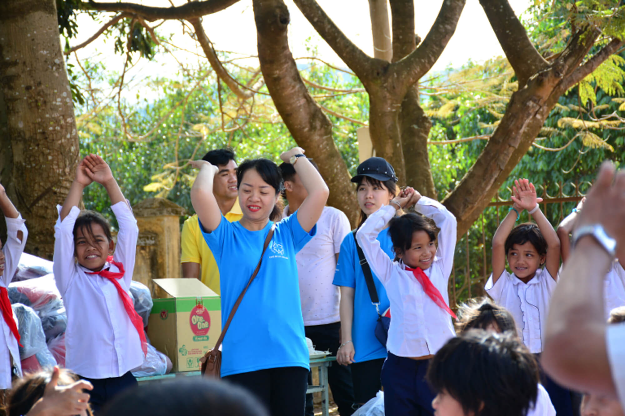 students are dancing on the schoolyard