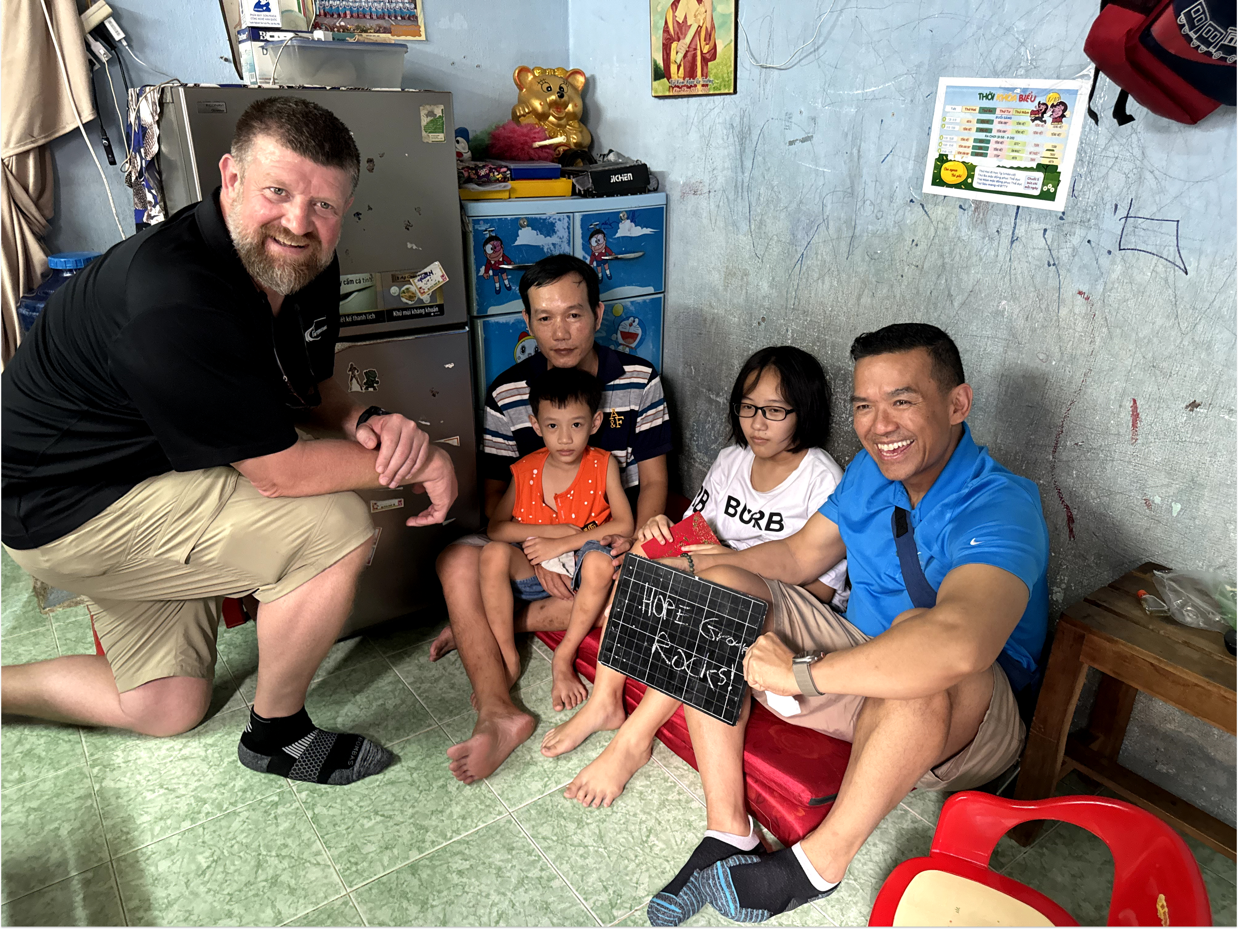 students are receiving gift in schoolyard