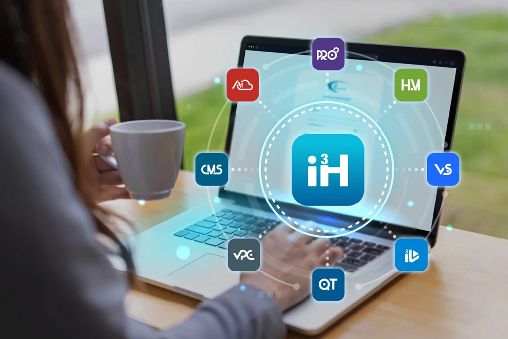 Person working on a laptop with i3Host icons displayed