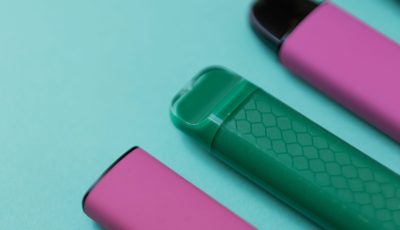 colorful-disposable-vape-devices-on-a-green-backgr-2026-03-25-09-36-07-utc