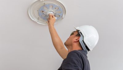 electrician-installs-lighting-fixture-on-a-ceiling-2026-03-26-22-53-26-utc